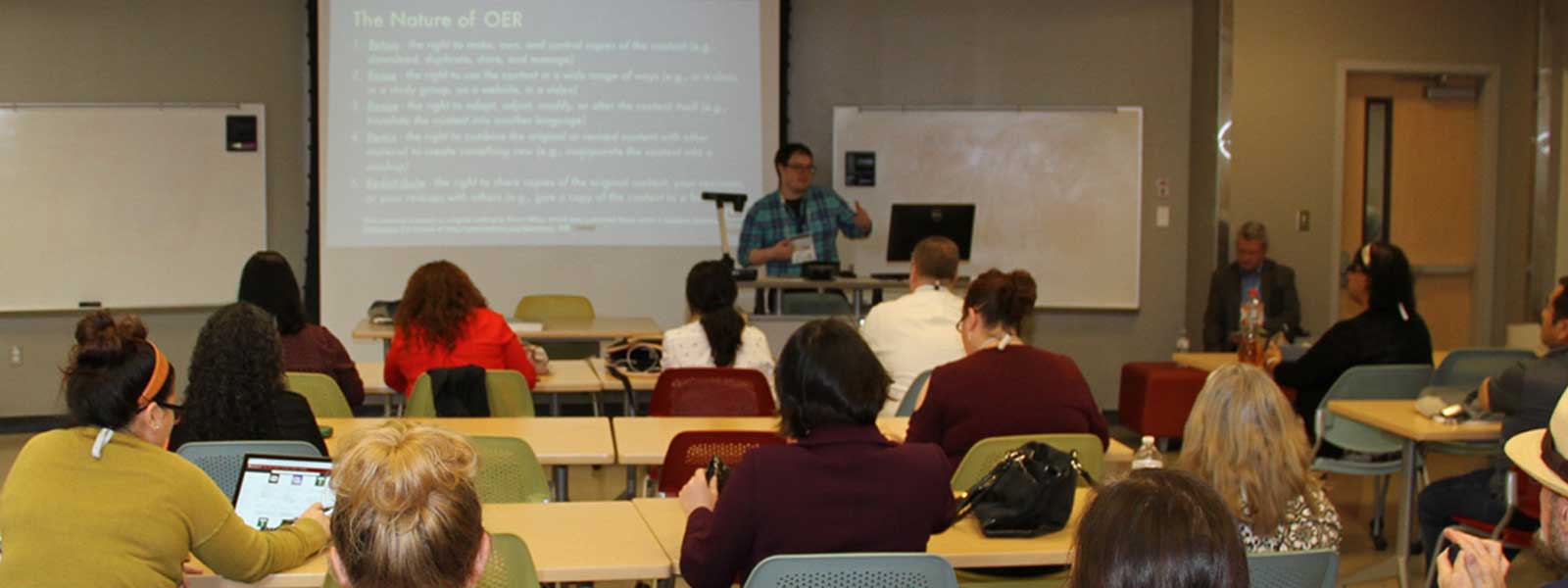 Faculty presenting on a conference session