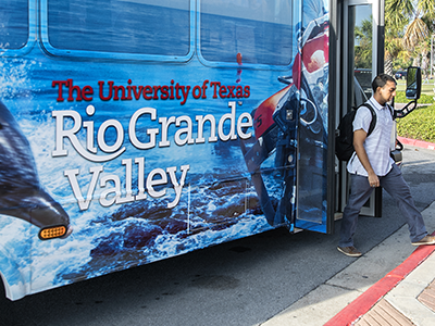 Student getting down from bus