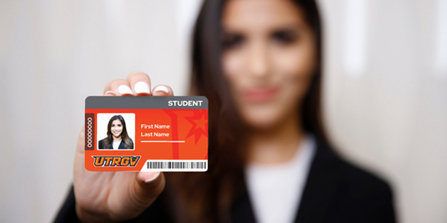 Student holding a sample V OneCard
