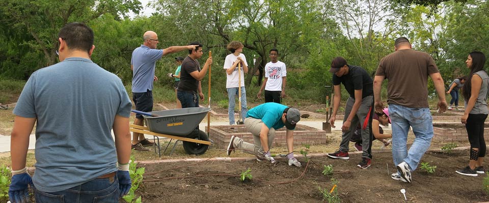 Dr. Fierro explains how to prepare the plant beds. Photo: JA Mustard