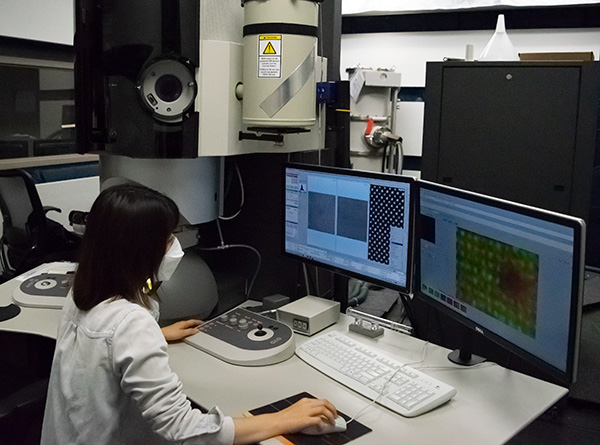 A researcher uses the Titan TEM at University of Minnesota Characterization Facility to examine a material