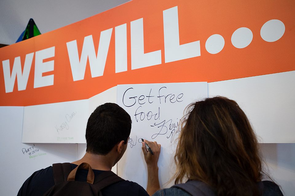 UTRGV students write on the 'We Will' board during Picnic With the President on Thursday, Sep. 3, 2015 at El Gran Salon in Brownsville, Texas. UTRGV photo by Paul Chouy