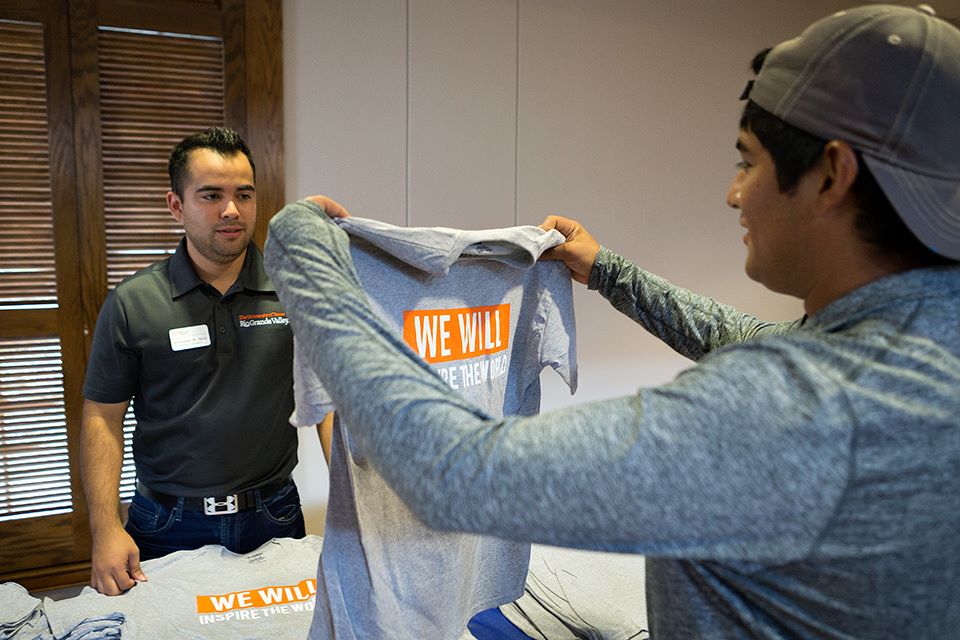 UTRGV student Ray Zuniga receives a tshirt during Picnic With the President on Thursday, Sep. 3, 2015 at El Gran Salon in Brownsville, Texas. UTRGV photo by Paul Chouy