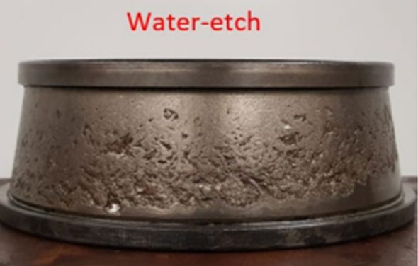 Freight bearing cup showing water-etch damage across the raceway