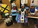 Photo of young students with project