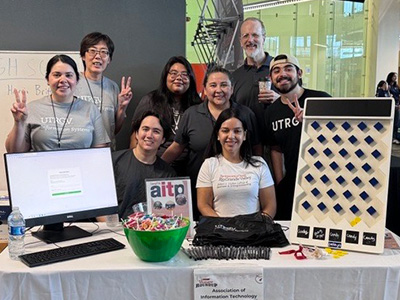 Group of students at a tabling event.