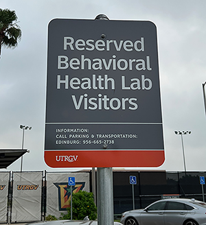 Parking sign showing reserved parking spots for Behavioral Health Lab in lot E19