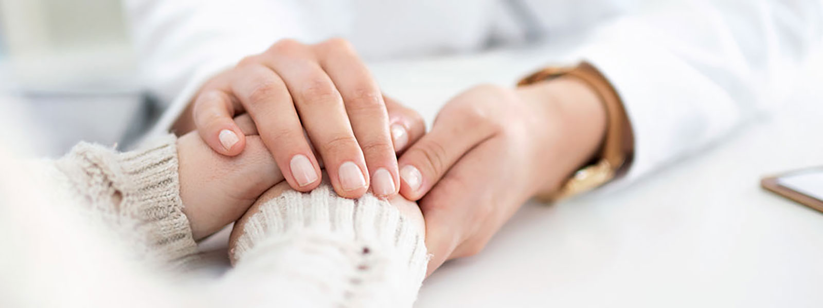Health Provider holding hands with patient