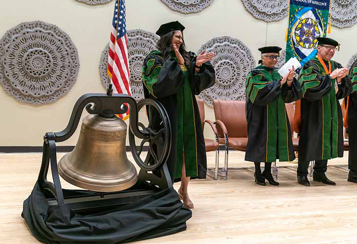 Our stately bronze bell, circa 1850, lives on the Brownsville campus. It is rung during commencement to symbolize a rite of passage and proclaims that a worthy and well-qualified individual has passed from one station in their life to a loftier one. Our bell is also the icon for the Bell Scholarship Endowment. Sahar Panjwani was selected to ring the bell at the SOM Commencement ceremony.  Page Banner 