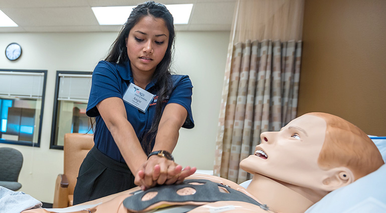 Medical students practicing patient care in clinical skills and simulation hospital