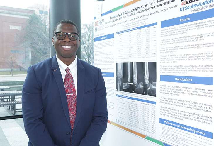 Image of UTRGV medical student in suit standing next to research poster at conference Page Banner 