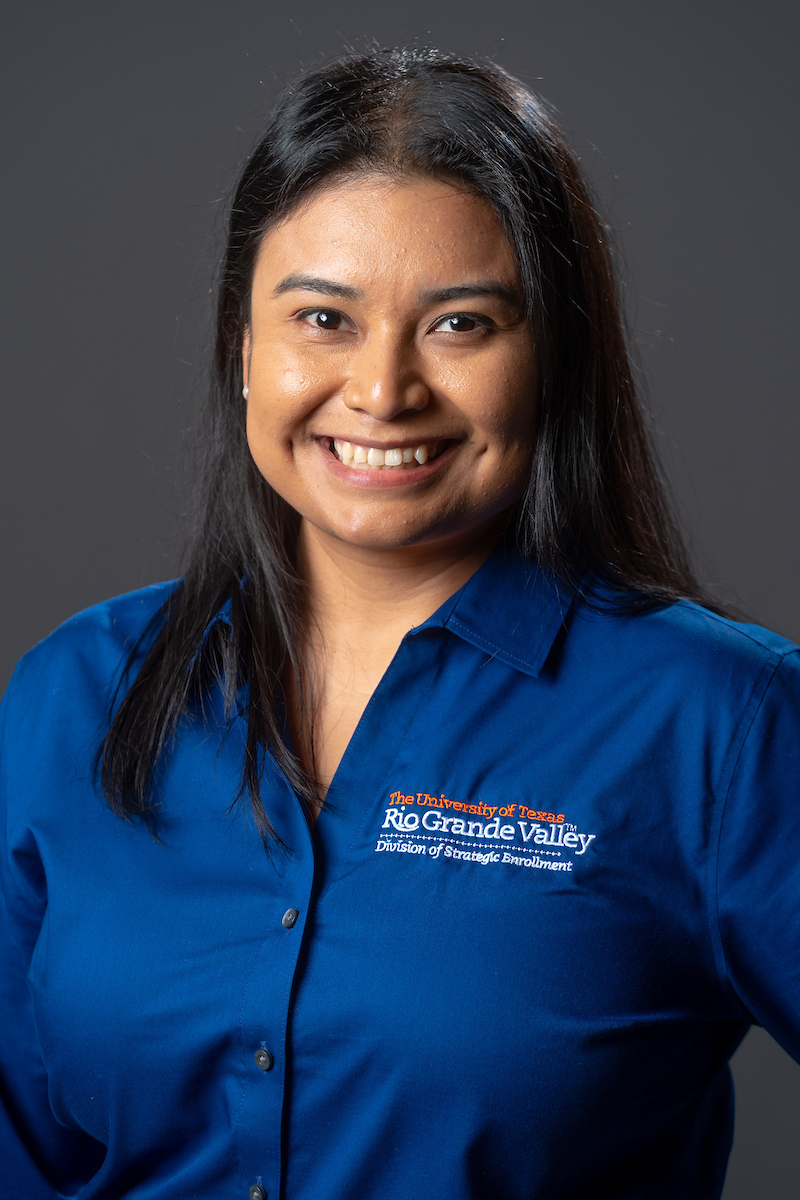 Smiling, staff photo.