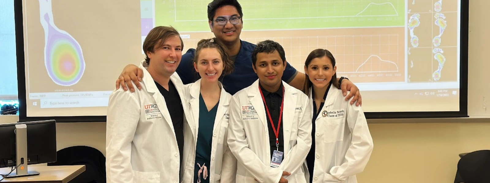 Faculty and student group photo during class.