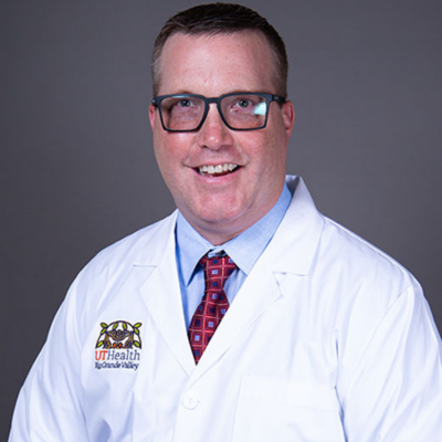 Smiling, faculty portrait.