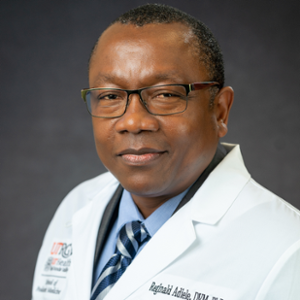 Portrait of Reginald Adiele looking at the camera