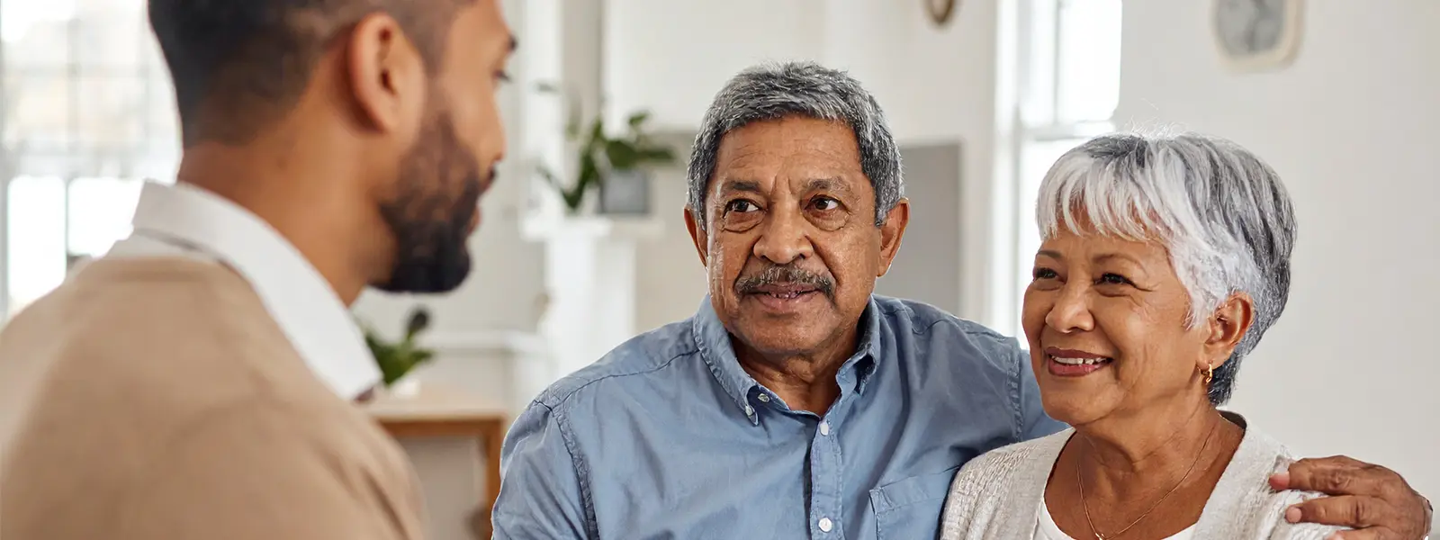Senior couple speaking to a Social Worker