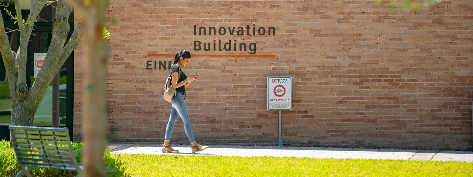 student walking by the Innovation Building in the Edinburg campus