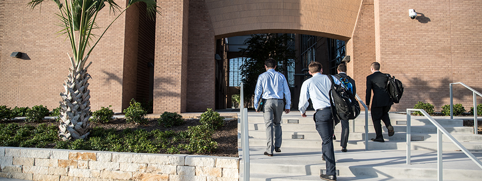 Group on students walking into School of Medicine Edinburg campus building