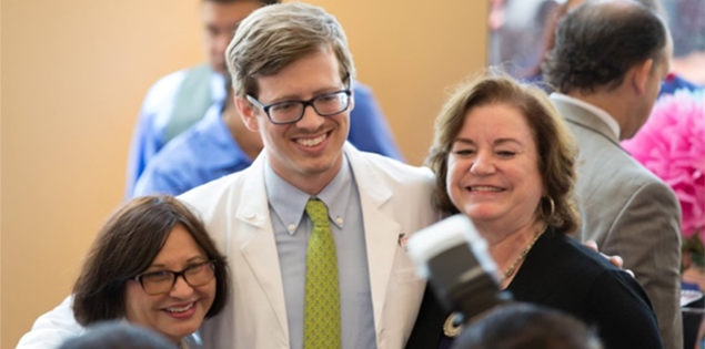 Dr. Valdez with medical student posing for a picture