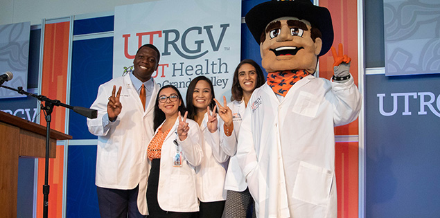 UTRGV Tuition Advantage (graduate smiling on commencement day)