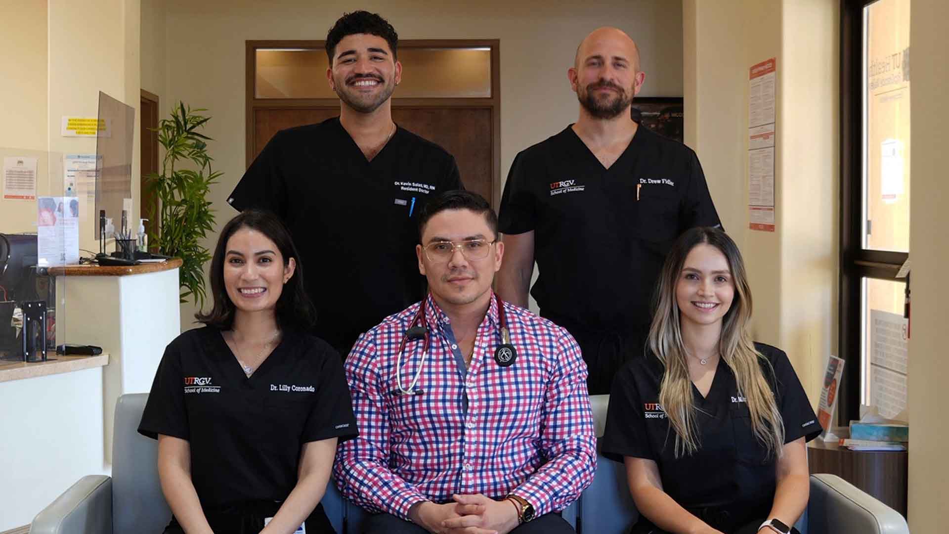 UTRGV physicians and resident doctors gather for a group portrait in a primary care clinic.
