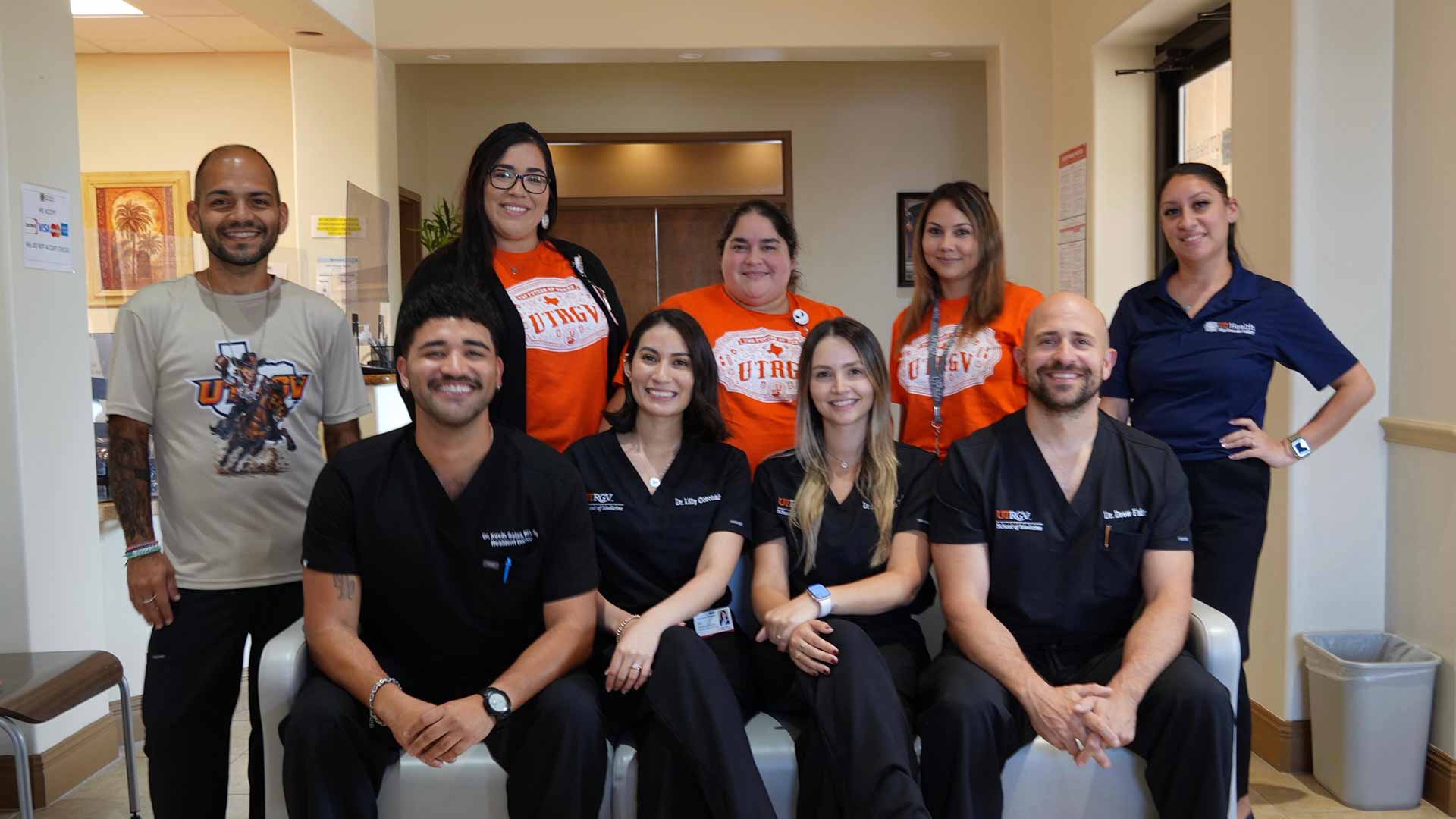 UTRGV physicians and residents gather for a group portrait in a primary care clinic.