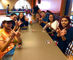 group of students playing UNO