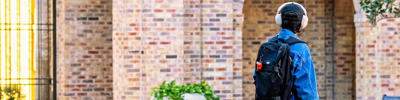 UTRGV Brownsville Student wearing headphones Podcast Banner 