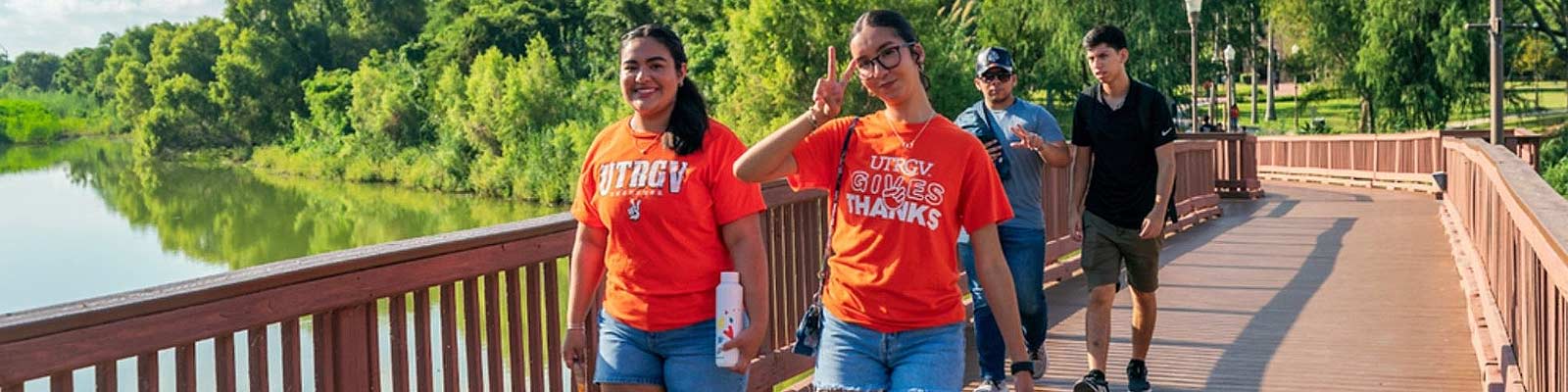 UTRGV Office for Sustainability Ambassadors Students walking along bridge