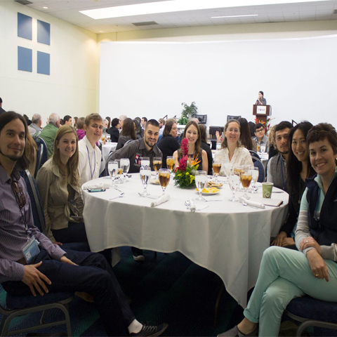 a group photo of people that attended the T.R.A.C.K.S event at their round table