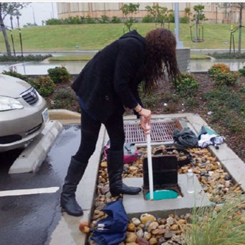 picture of woman working on bioswale