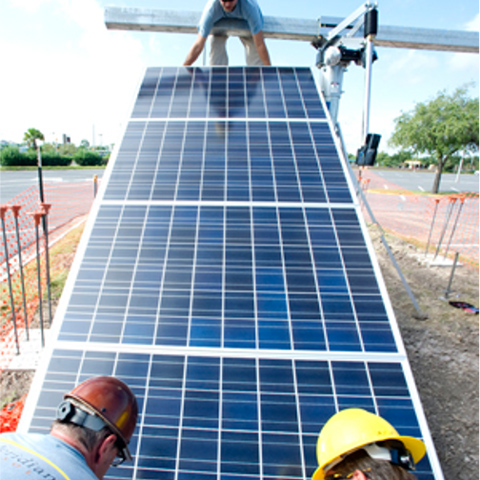  of men constructing the tracking solar array on UTRGV's Edinburgh Campus