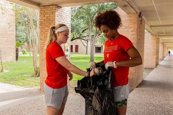 Jena' Williams and Jessica Martino, UTRGV Women's Basketball players, help clean up the Edinburg Campus on Friday as part of National Cleanup Day. While Saturday is National Cleanup Day, the entire month of September is National Cleanup Month. (UTRGV Photo)