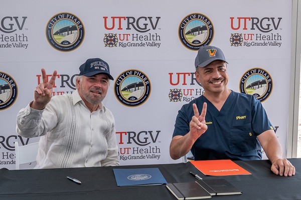 UTRGV President Guy Bailey and City of Pharr Mayor Ambrosio Hernandez, M.D., celebrate the UTRGV School of Nursing expansion at a signing ceremony on Thursday, Sept. 2, in Pharr, Texas.