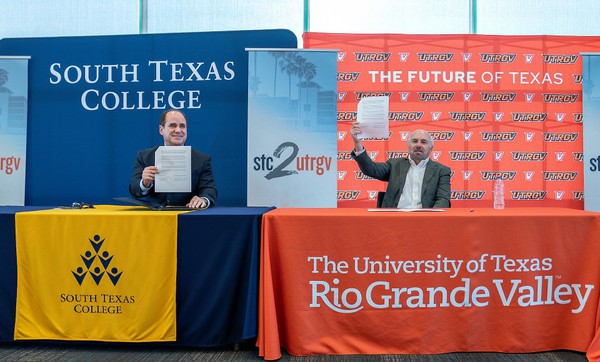 UT Rio Grande Valley and South Texas College signed a joint admissions agreement to create an easy pathway for STC students to transition to UTRGV on Wednesday in McAllen. STC President Ricardo Solis and UTRGV President Guy Bailey celebrate the partnership, called "STC 2 UTRGV," during the signing ceremony. (UTRGV Photo by Paul Chouy)