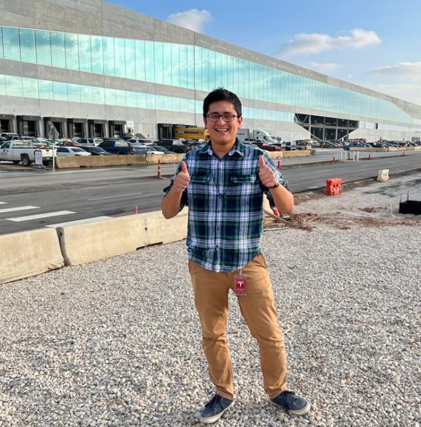 Martin Alejandro Galicia Avila, a UTRGV graduate student from Matamoros, Tamaulipas, Mexico, is currently an intern with Tesla. Galicia, who is posing in front of the new Tesla Gigafactory in Austin, has interned with four other manufacturing companies during his time at UTRGV. (Courtesy Photo)