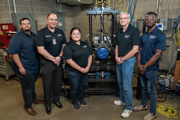 UTRGV Mechanical Engineering students and faculty members who invented and licensed the patent for railroad industry improvement. From left to right are Lee Roy Cantu, POI guest; Dr. Constantine Tarawneh, senior associate dean for Research and Graduate Programs and director of the University Transportation Center for Railway Safety; Danna Capitanachi, student academic assistant; Dr. Robert Jones, professor of mechanical engineering; and Prince Evans Mensah, student project associate. Hum Industrial has exclusively licensed the rights to the safety invention from the UT System Board of Regents and is working with Tarawneh and his team to develop it into a real-world product.