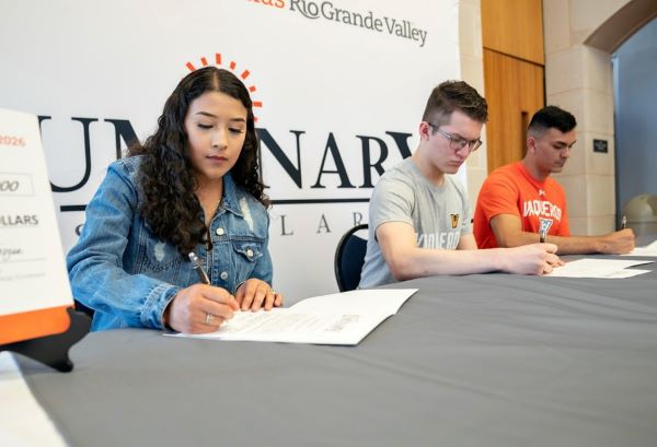 UTRGV Luminary Scholars – Victoria Gutierrez, David Franco and Jarrett Quezada – sign acceptance agreements on April 22, 2022 at the UTRGV Visitors Center in Edinburg during a special signing ceremony. (UTRGV File Photo by Paul Chouy)