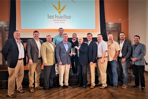 Pictured (left) are Las Huellas Association board members Ronald Humphrey and Nick Tipton, Vice President and Treasurer Russell Adams, Steve Garza, President Edward Mathers, Secretary Monica Garza, UTRGV President Guy Bailey, and board members Ricardo Adobbati, Rusty Young, Brad Wolfe, Ross Bland and Bryant Kennedy. (Courtesy Photo)