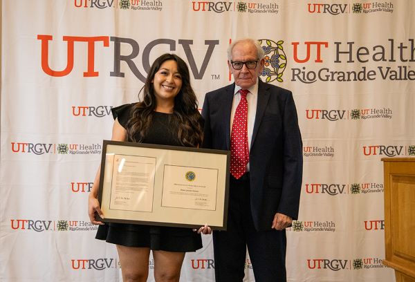 UTRGV School of Medicine student Briana Gonzalez DiGrazia was nationally recognized by the U.S. Public Health Service with the Excellence in Public Health Award. The award recognizes visionary medical students who are advancing initiatives to improve public health and addressing public health issues in their community. Dr. Stanley Fisch, professor of Pediatrics at the UTRGV School of Medicine, recently presented Gonzalez DiGrazia with the honor at the SGA (Student Government Association) Student and Faculty Appreciation Ceremony. (UTRGV Photo by Heriberto Perez-Zuniga)