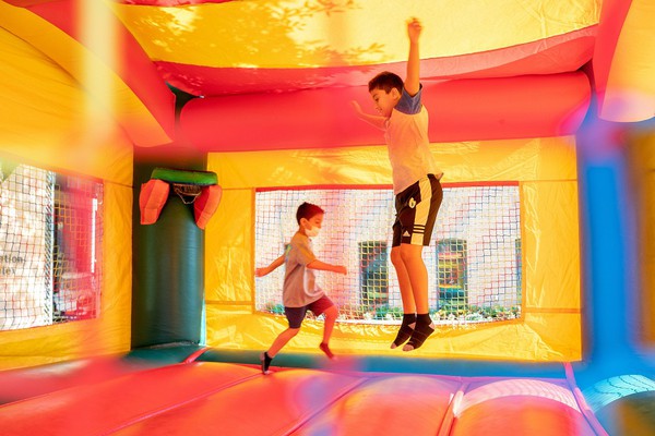 Two Kids from the Team Mario Summer Camp in a bouncy house