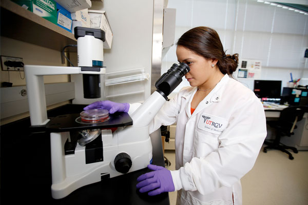 Sustainability Researcher checking container