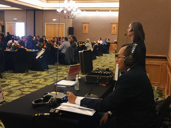 Picture of people working as interpreters in a conference