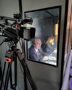 Two persons inside a radio cabin