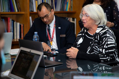 Picture of a woman in a conference 