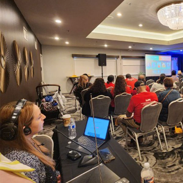 Woman interpreter at an event.