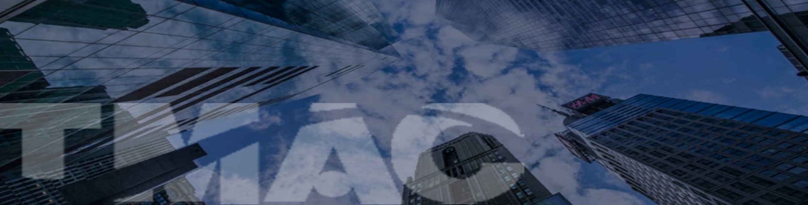 Background image of TMAC logo on panoramic view among buildings