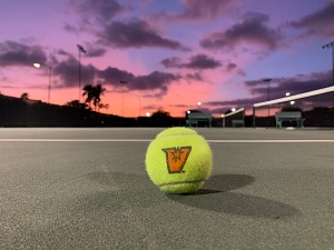 tennis ball and sunset on the background